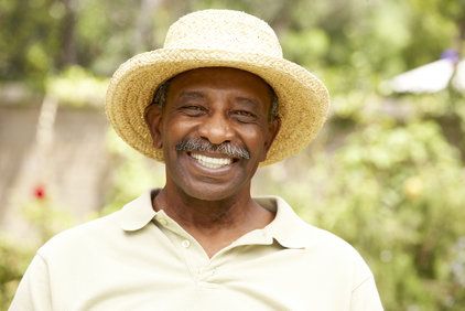 Smiling Senior Man In Garden